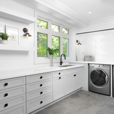 grey hexagon large format tile floor in combined laundry mudroom with sink